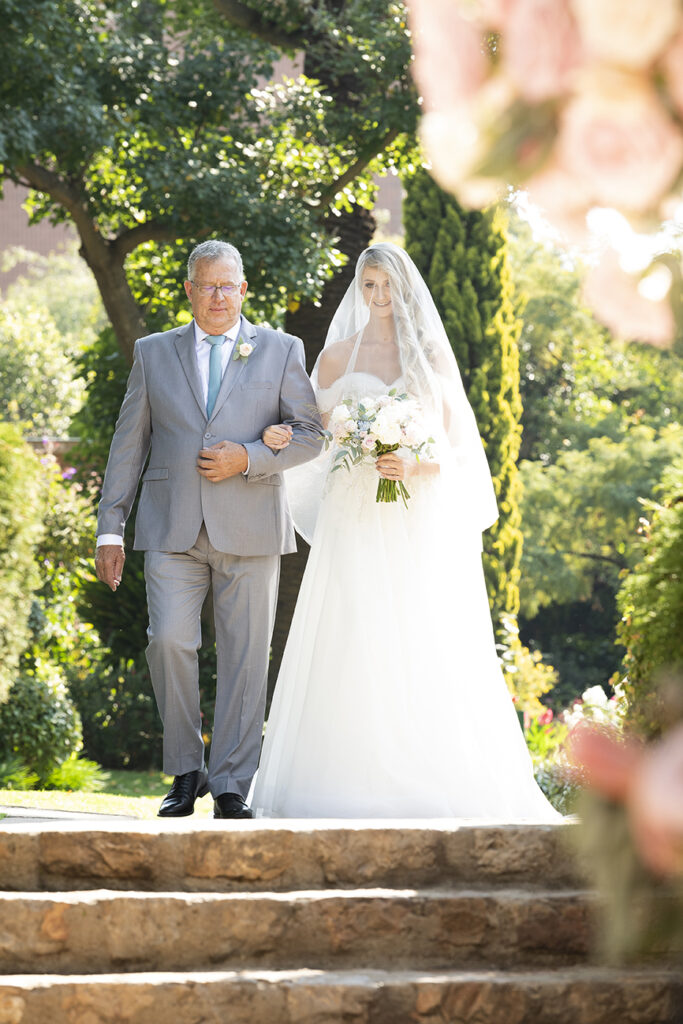 Candid wedding portrait photography of bride and her father at Shepstone Gardens shot by Kevin Mark Pass, bridal makeup by Storm Pass
