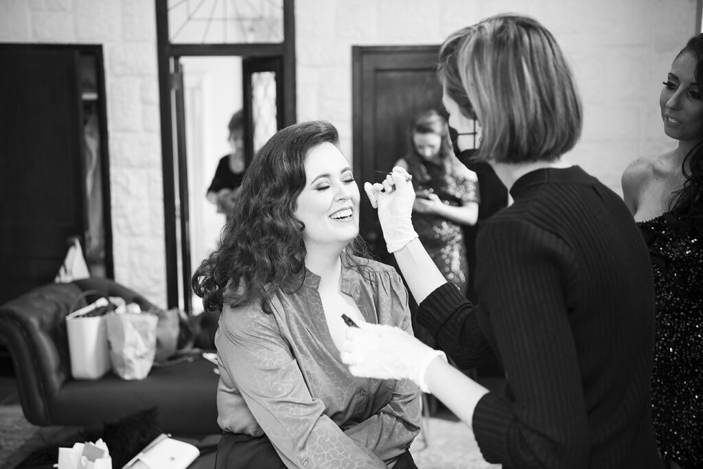 Bride getting ready with Storm Pass Makeup on her big day at Shepstone Gardens, candid black & white wedding photography by Kevin Mark Pass